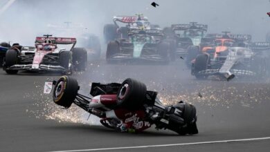 Alfa Romeo driver Guanyu Zhou of China crashes at the start of the British Grand Prix