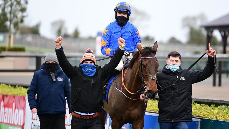 Dreal Deal ridden by jockey Denis O'Regan (centre) with owner & trainer Ronan McNally (left) and son Tiernan