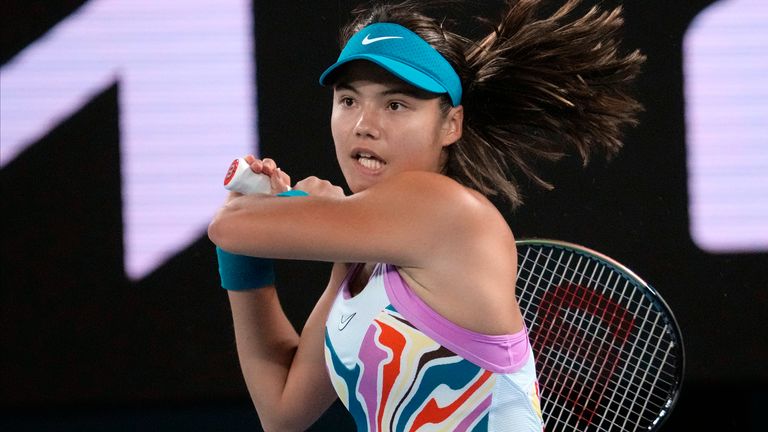 Emma Raducanu of Britain plays a backhand return to Coco Gauff of the U.S. during their second round match at the Australian Open tennis championship in Melbourne, Australia, Wednesday, Jan. 18, 2023. (AP Photo/Dita Alangkara)