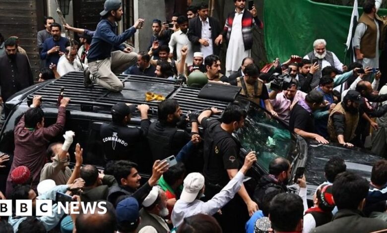 Imran Khan mobbed by supporters as he leaves for court