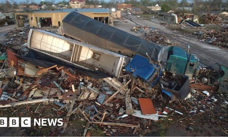 Trucks piled on buildings as tornado hits Mississippi