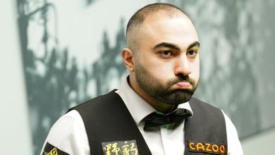 Hossein Vafaei beat Ding Junhui to set up a second-round clash with Ronnie O'Sullivan