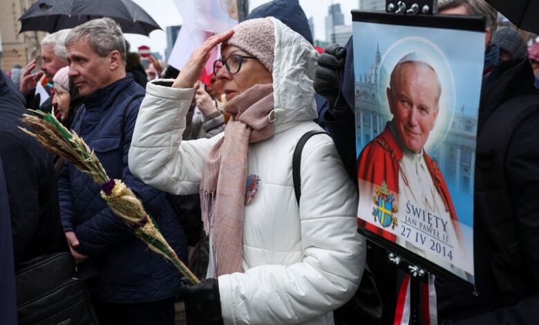 Poles march to defend Pope John Paul II against abuse cover-up accusations