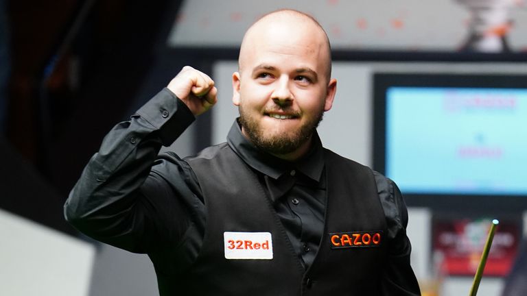 Luca Brecel celebrates his famous win over Si Jiahui