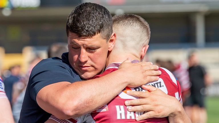 Wigan head coach Matt Peet embraces Ryan Hampshire following Saturday's Challenge Cup win over Leeds